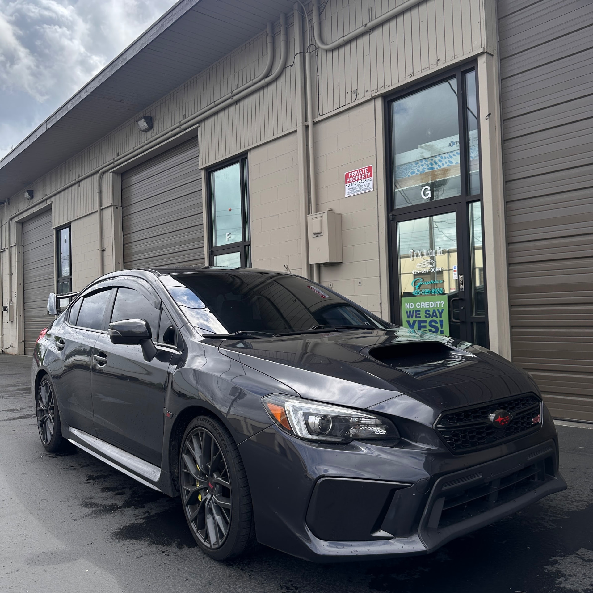 Subaru WRX parked in front of the F&N Window Tint shop
